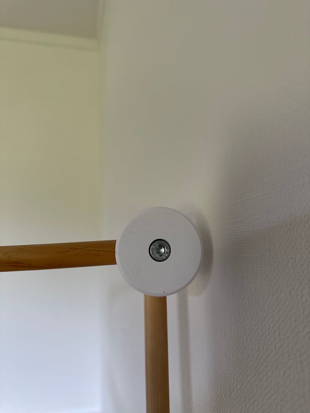 White 3D printed piece of a cot arm