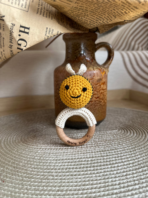 crocheted Baby bee rattle with a wooden ring