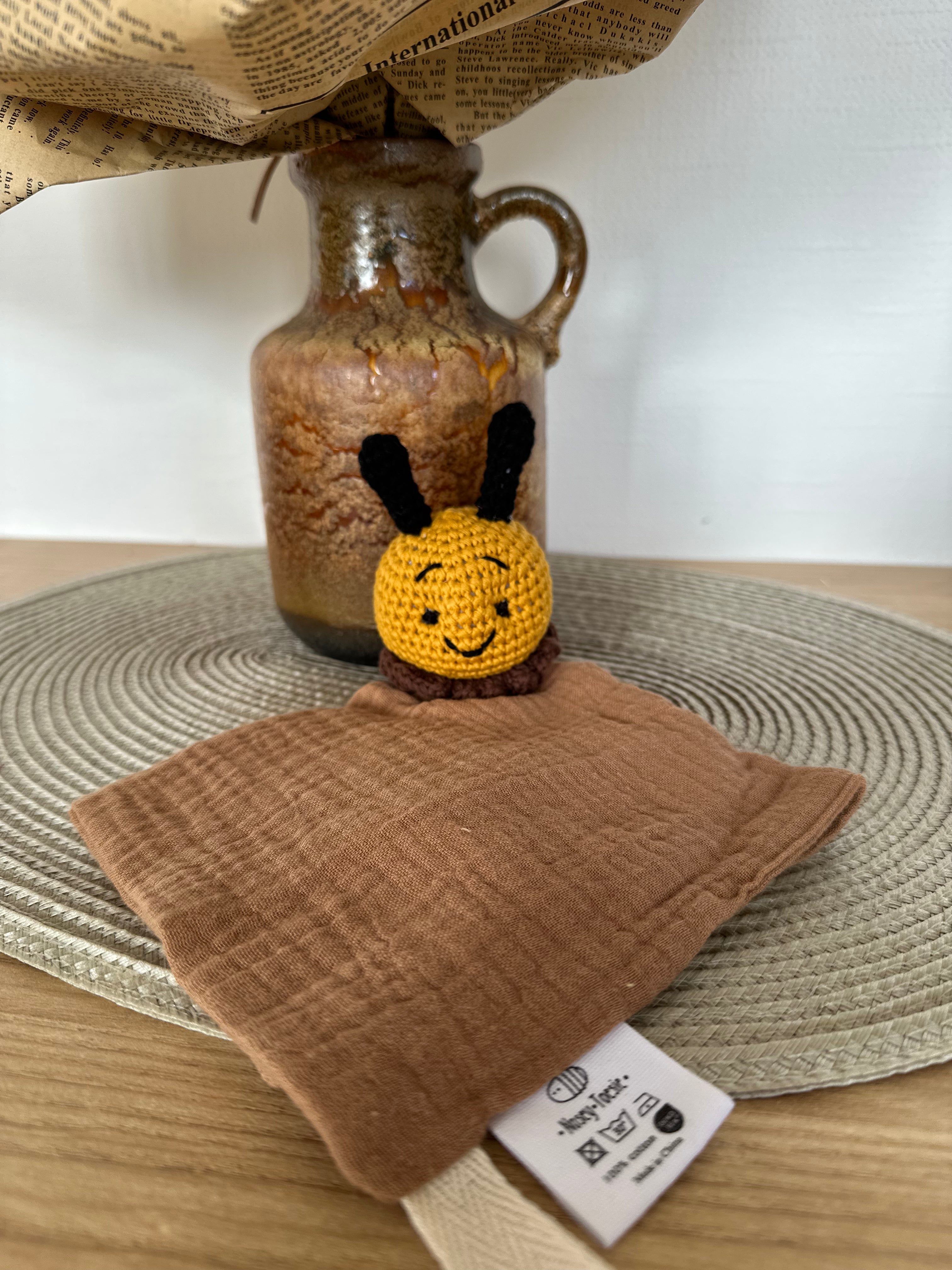 Crocheted bee baby comforter with brown material
